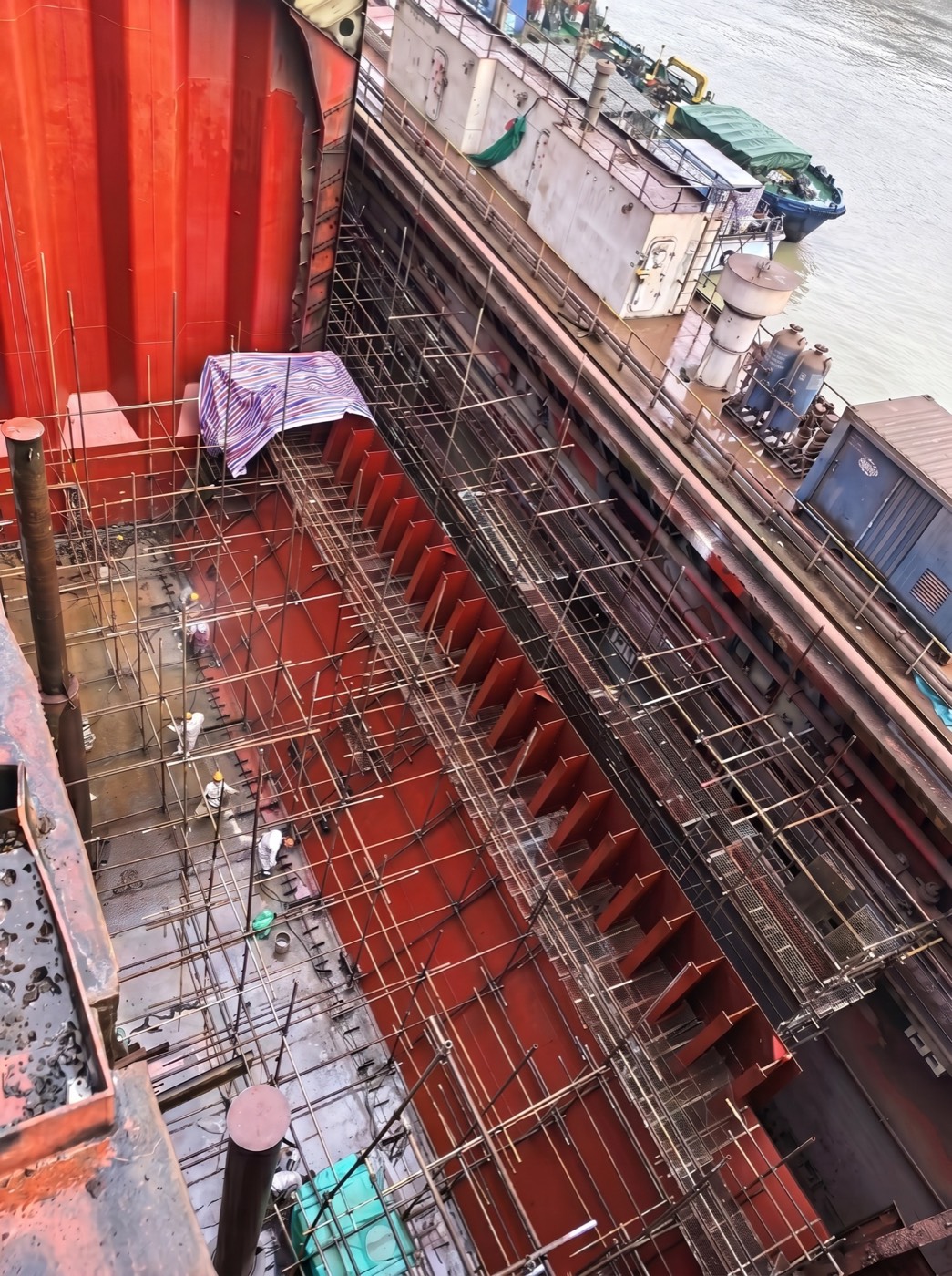 Rebuilt hold with new red-primed structural framing