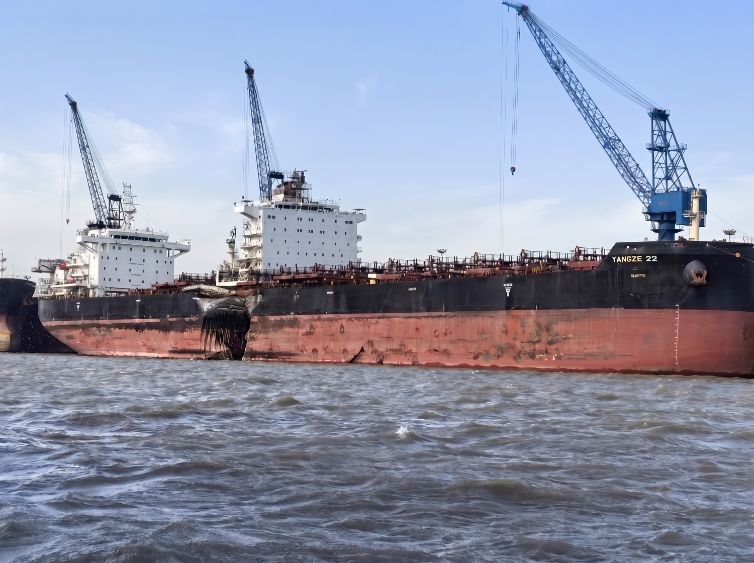 Breached, fire-scarred hull and cargo hold